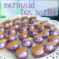 Clam cookies on a tray with text overlay: Mermaid Tea Party.