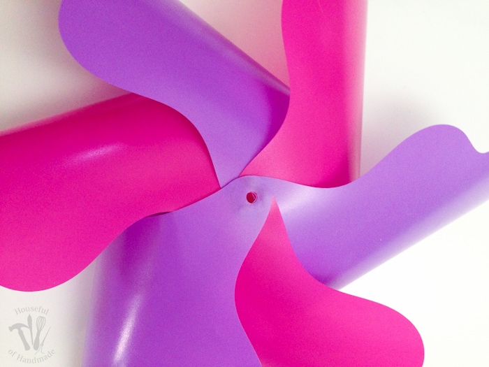 in process photo of 6 pinwheels being put together in pink and purple colors