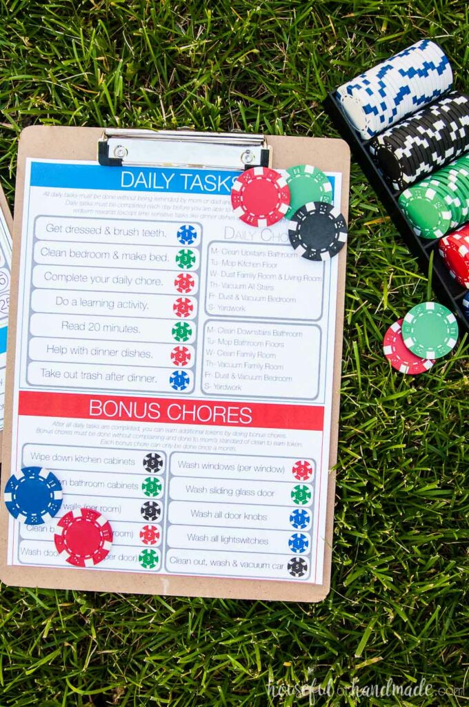 kids chore chart system on grass with chips