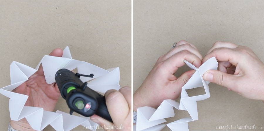 Two pictures: one showing a dot of glue being applied to the inside of the fold and the other showing the fold pinched together to secure. 