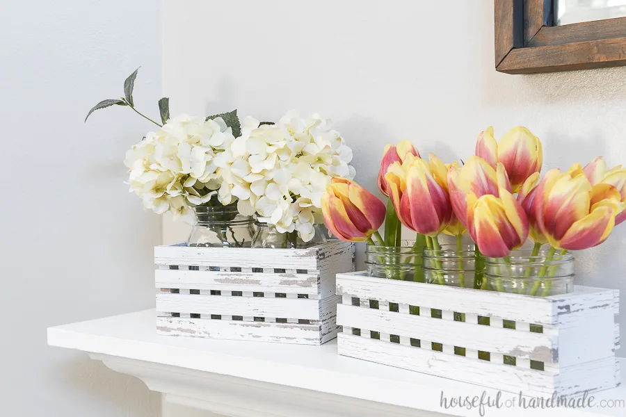 White lattice trough boxes with flowers.
