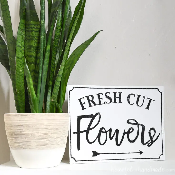 DIY flower market sign that looks like a farmhouse metal sign.