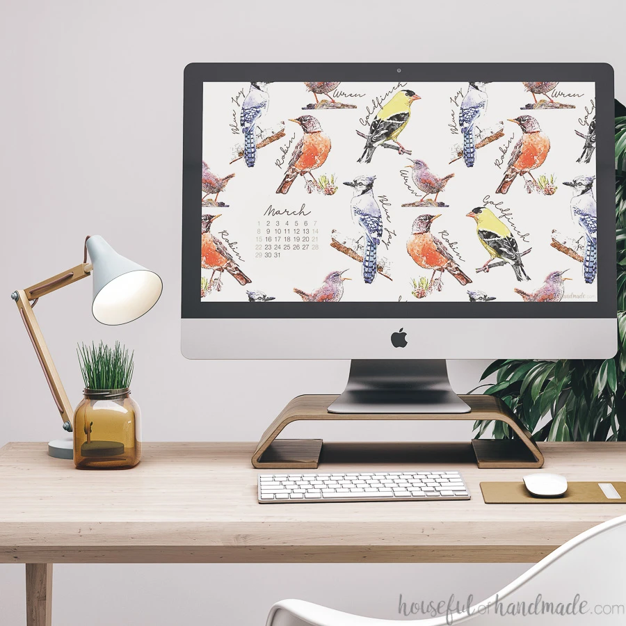 iMac computer with a spring digital wallpaper on the desktop. 