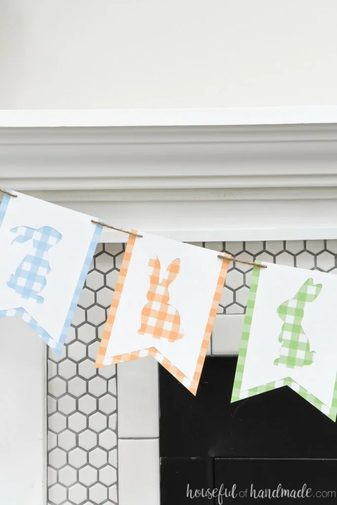 Close up of the three bunny cut-outs in the gingham check banner.