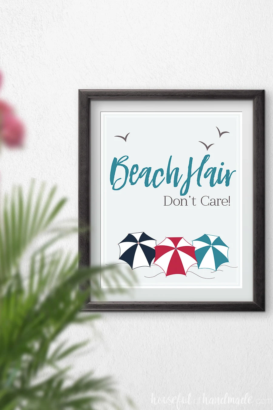 Beach Hair don't care art with beach umbrellas in red, turquoise and navy. 