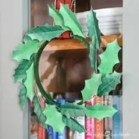 paper holly wreath on door