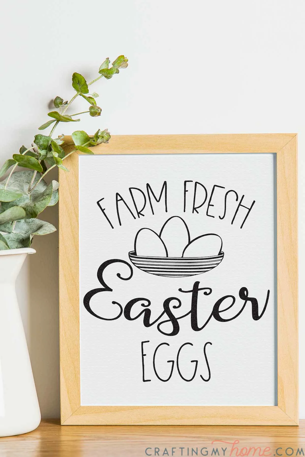 Simple easter sign that says "Farm Fresh Easter Eggs" with a sketch  of a bowl filled with 3 eggs in a picture frame. 