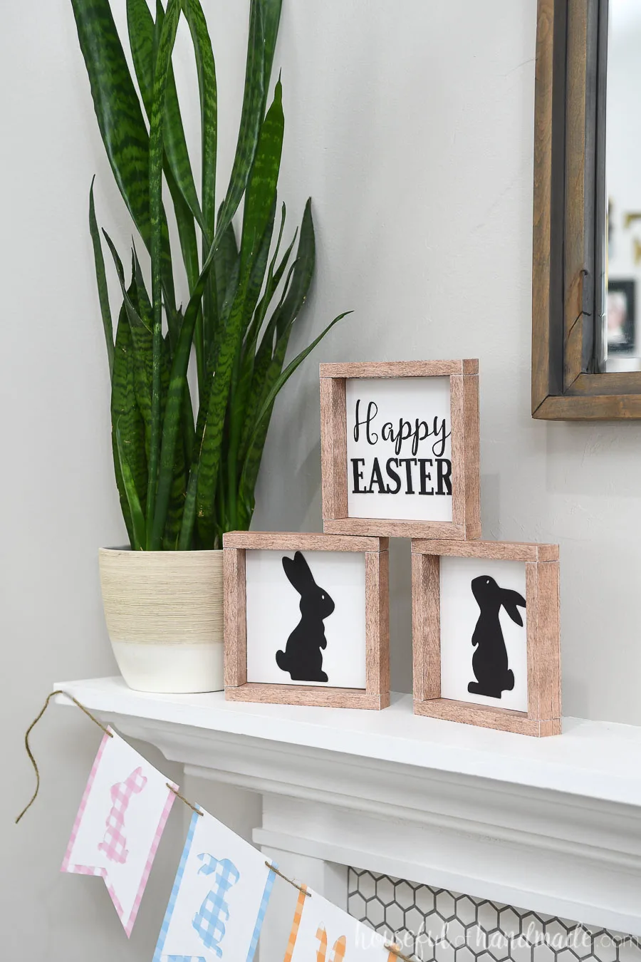 Fireplace mantel decorate with Easter signs for spring.
