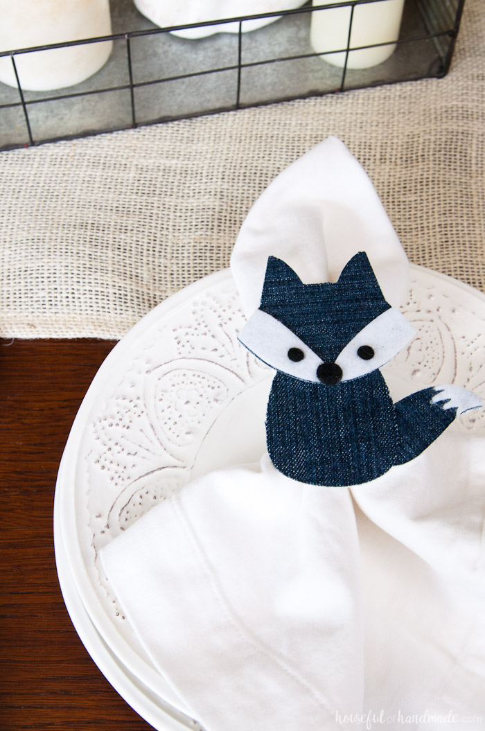 Close up of the fox napkin ring made from upcycled jeans on the table. 