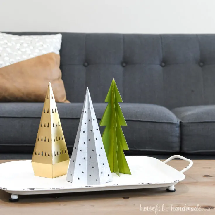 Tray of paper Christmas trees used to decorate with paper Christmas decor.