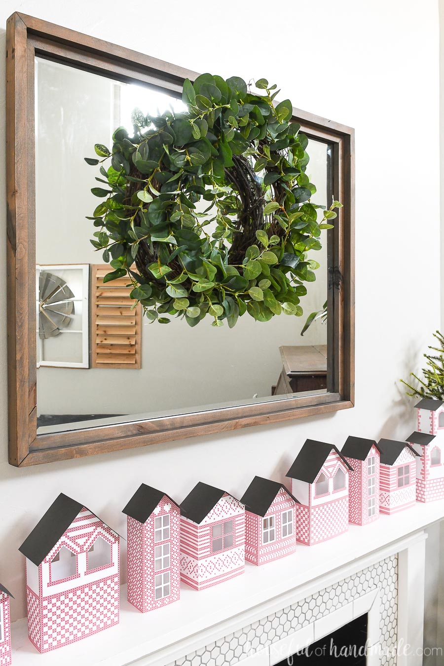 This eucalyptus wreath was made in just 7 minutes to hang as part of the Christmas mantel decor. 