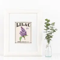 White frame with white mat and printable art that looks like a vintage seed packet for Lilac flowers.