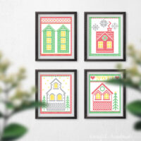 Four printable Christmas art prints that look cross-stitched houses.