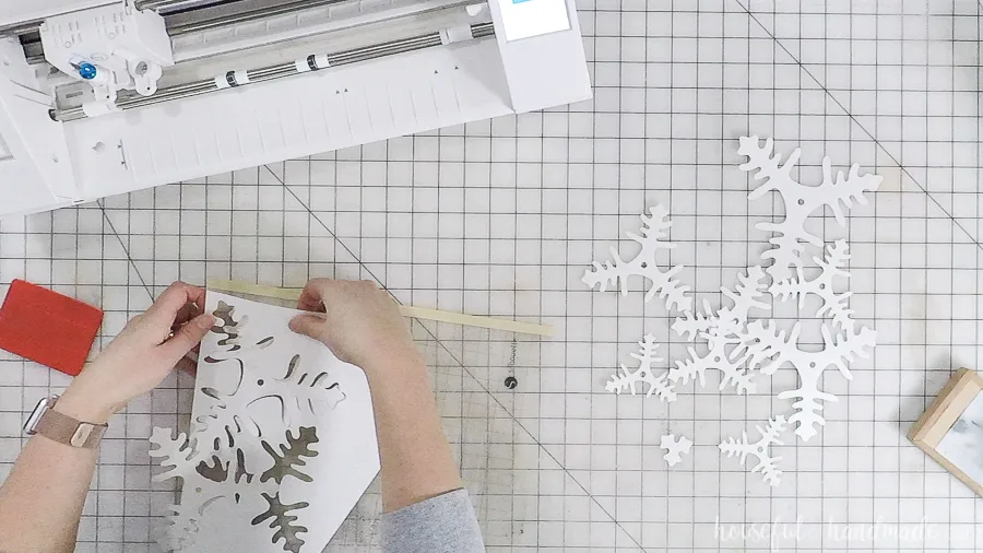 assembling cut out paper christmas trees