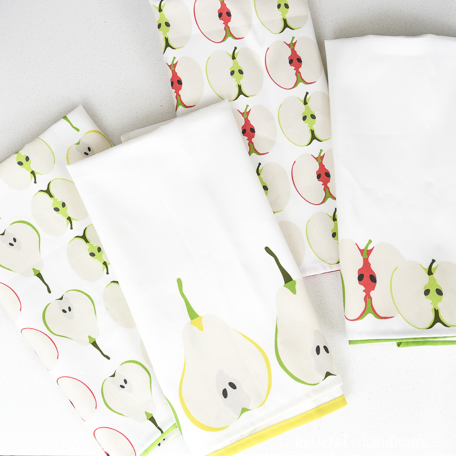 Four DIY tea towels made from custom printed fabric.