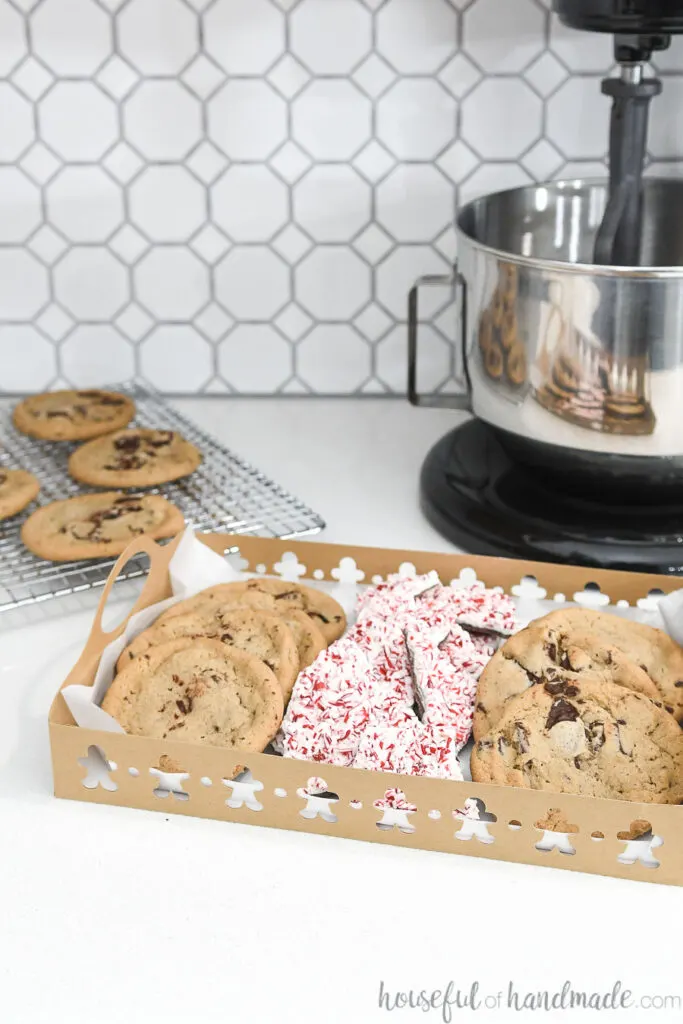 one paper christmas cookie tray on counter with mixer