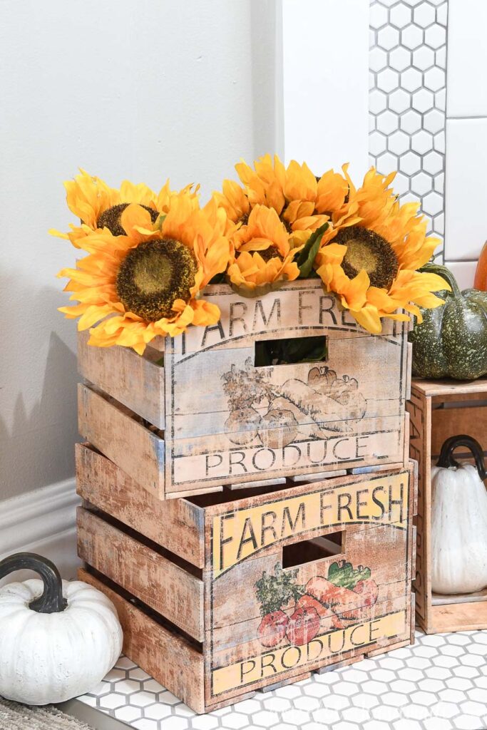 Farm fresh produce crates for home decor made out of paper with fall flowers and pumpkins in them. 