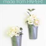 Faux metal wall vases hanging on a wall with text overlay: Metal Wall Vases made from Paper!