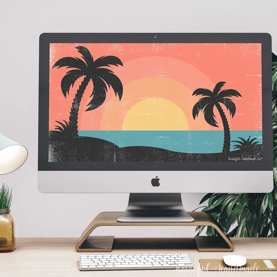 iMac computer on a desk with a summer digital background on it.