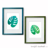 Two printable tropical leaf prints in frames.