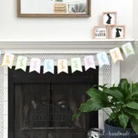 Fireplace decorated with a gingham check bunny banner hung on twine.