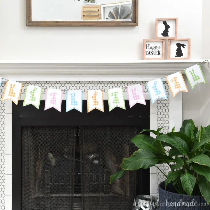 Fireplace decorated with a gingham check bunny banner hung on twine.