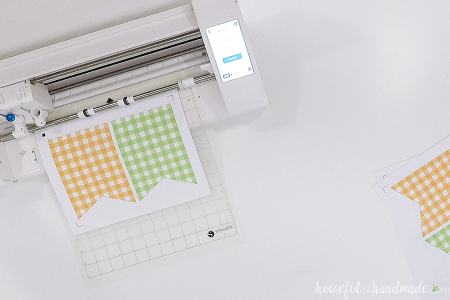 Cutting out the gingham check buntings with a Silhouette cameo print & cut. 