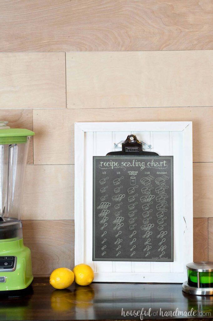 printable scaling chart on clip board in kitchen