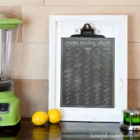 This printable recipe scaling chart is the perfect kitchen helper tool. Includes measurements to help you 1/3, half, 1 1/2 and double a recipe. Cute chalkboard printable on a white beadboard picture frame.
