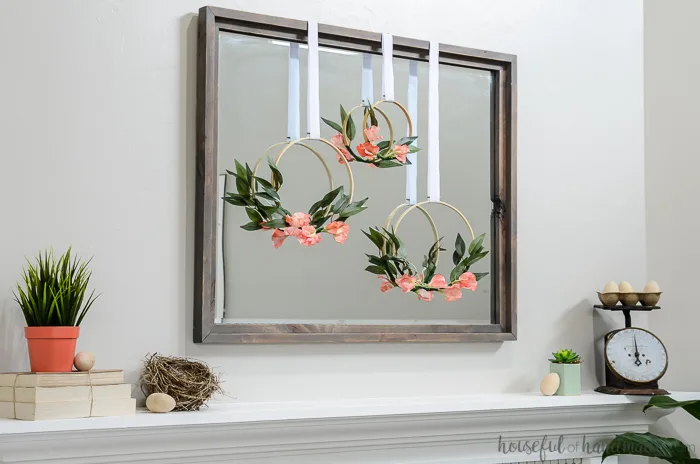 large mirror with 3 spring hoop wreaths over mantel