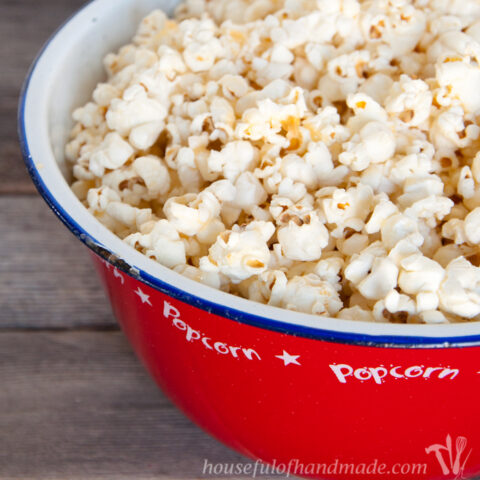 Red popcorn tub filled with brown butter and honey popcorn.