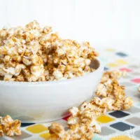 caramel popcorn in white bowl on table