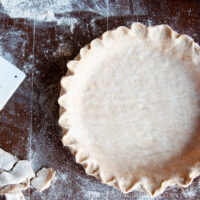 whole wheat pie crust on counter with flour