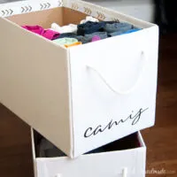 Boxes covered with drop cloth to make beautiful storage boxes for the home.
