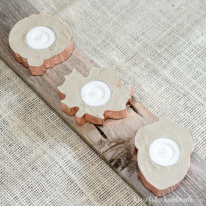 Learn how to make copper tea light holders out of concrete and cookie cutters. Perfect for decorating for any season.