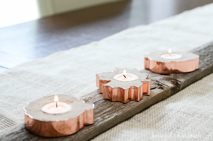 Add sparkle to your rustic fall decor with these easy copper candle holders. They are made out of concrete and hold tea lights for the perfect bit of warmth this fall.