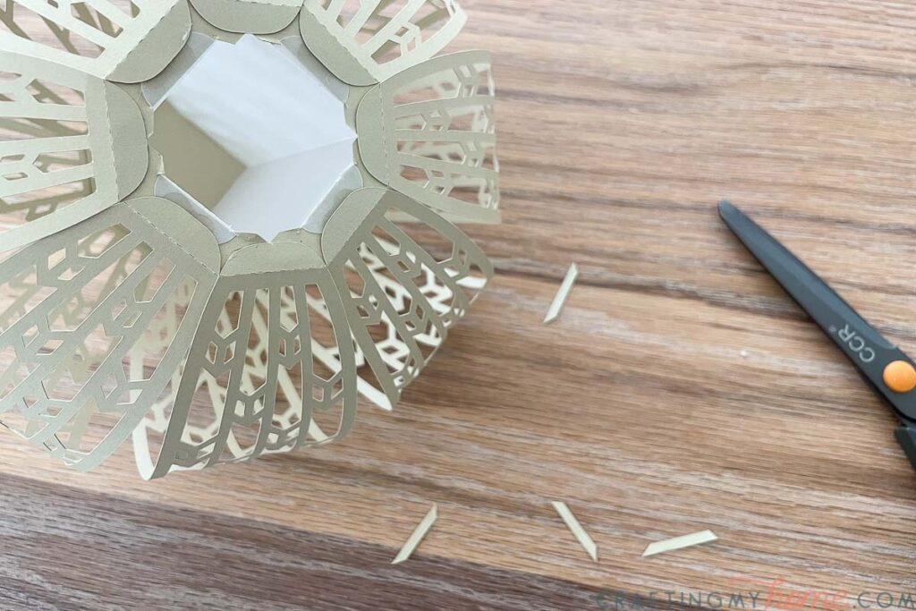 Bottom of the smallest paper lantern with the opening to the column made larger. 