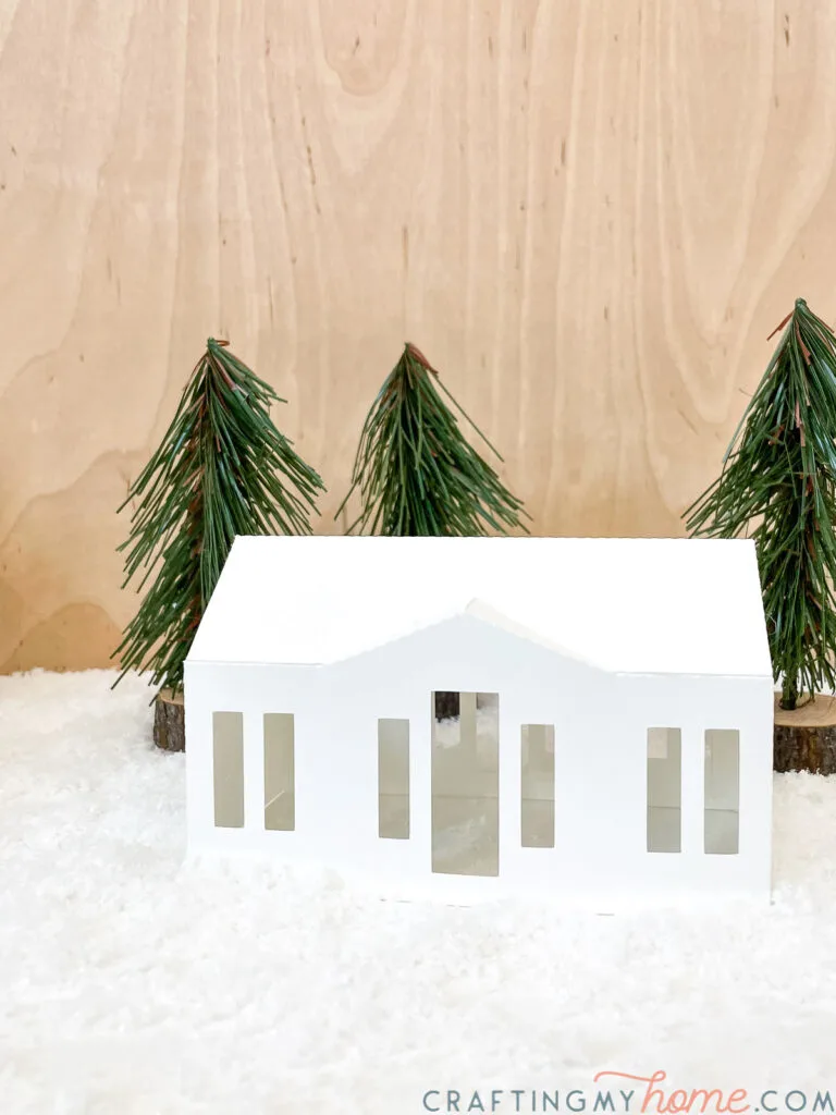 Modern ranch style paper Christmas house. 