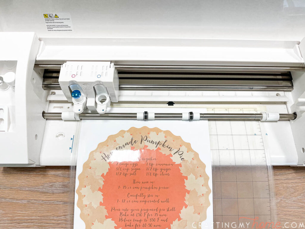 Loading the pumpkin pie vinyl design into a Silhouette cameo cutting machine. 