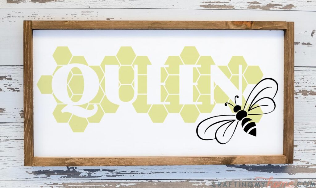 Farmhouse wood sign with Queen Bee SVG on it in a honeycomb pattern. 