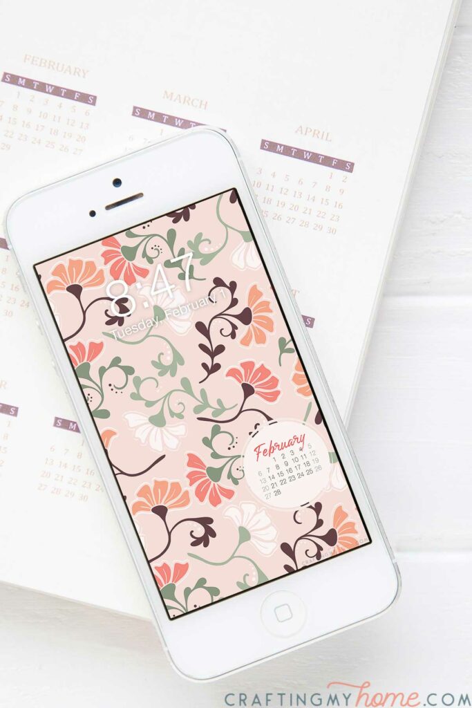 Free digital wallpaper for February on a white iPhone screen.