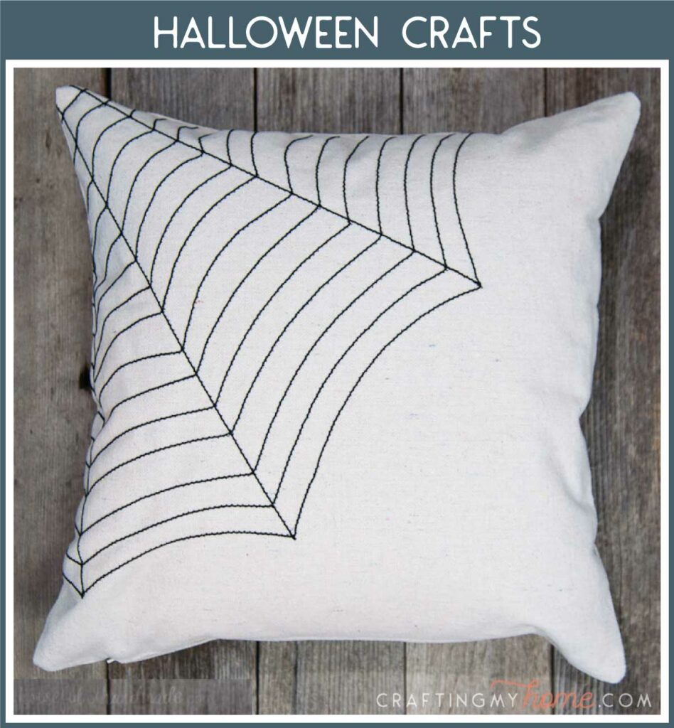 Halloween spiderweb pillow with header "Halloween Crafts" in navy. 