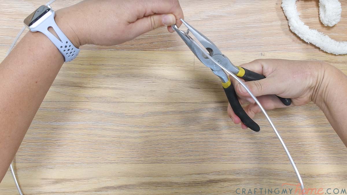 Twisting the wire together with needle nose pliers. 