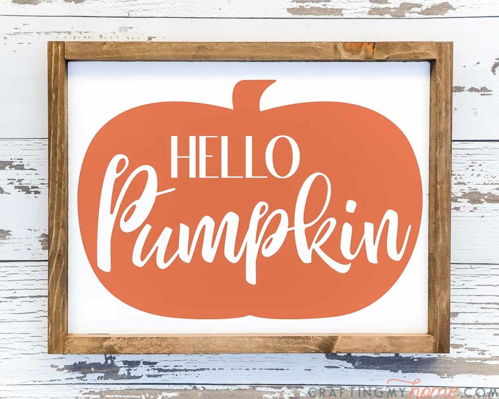 Hello Pumpkin design on a wood sign with white background. 